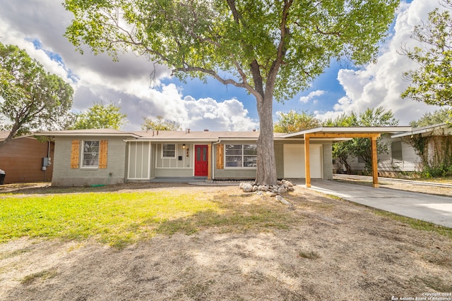 single story home featuring covered porch, a garage, and a carport