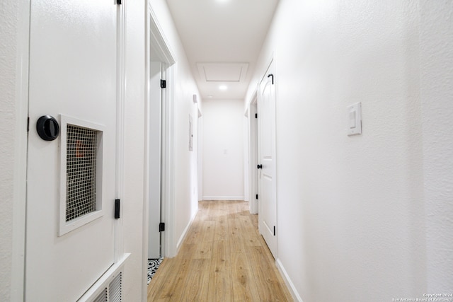 corridor with light wood-type flooring