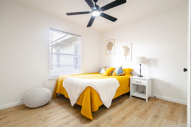 bedroom with light wood-type flooring and ceiling fan