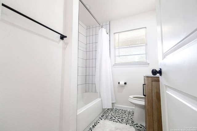 bathroom with toilet, shower / bath combo, and tile patterned floors