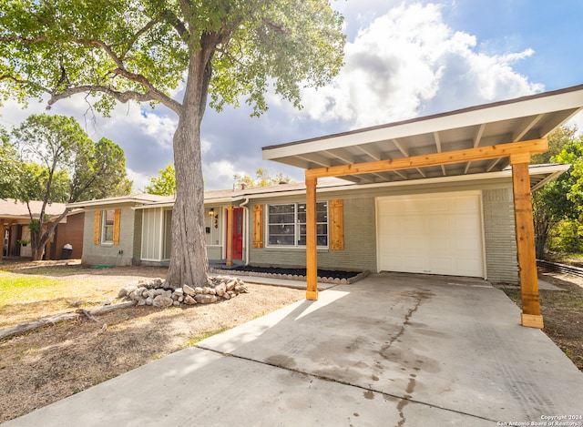 ranch-style home featuring a carport