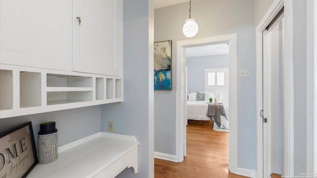 hallway featuring hardwood / wood-style flooring