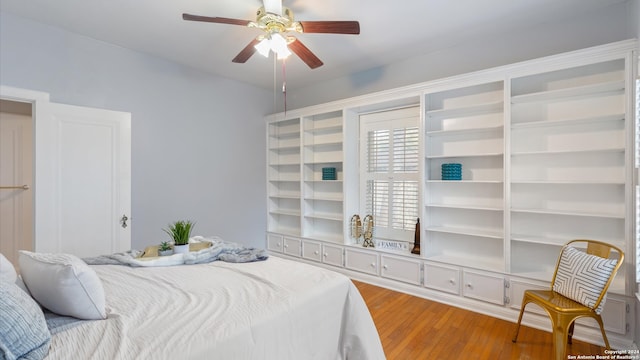 bedroom featuring hardwood / wood-style floors and ceiling fan