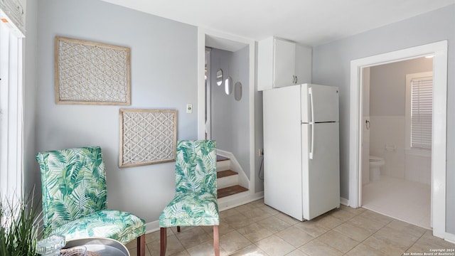 living area with light tile patterned flooring