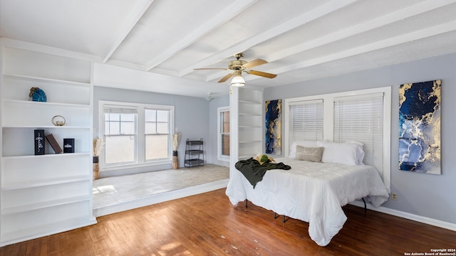 bedroom with ceiling fan, beamed ceiling, and hardwood / wood-style floors