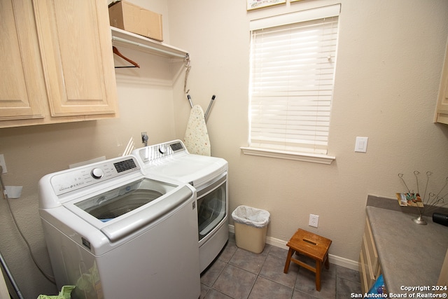 washroom featuring tile patterned floors, cabinets, and independent washer and dryer