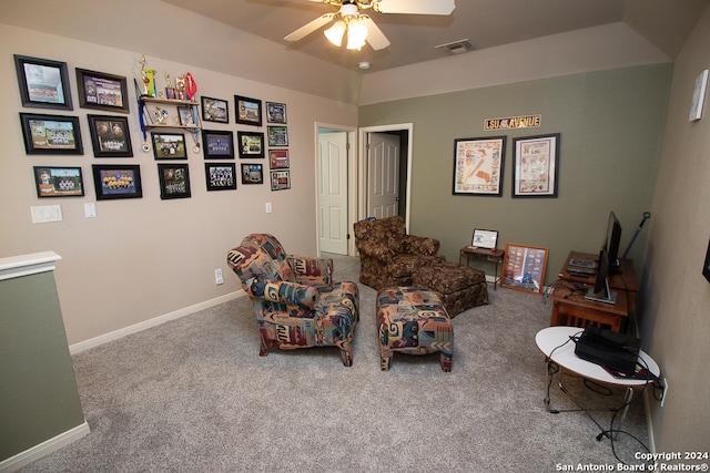 sitting room with carpet and ceiling fan