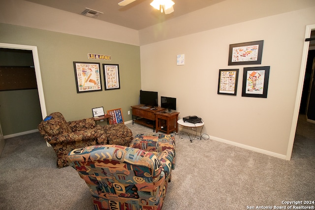 living room with carpet flooring and ceiling fan