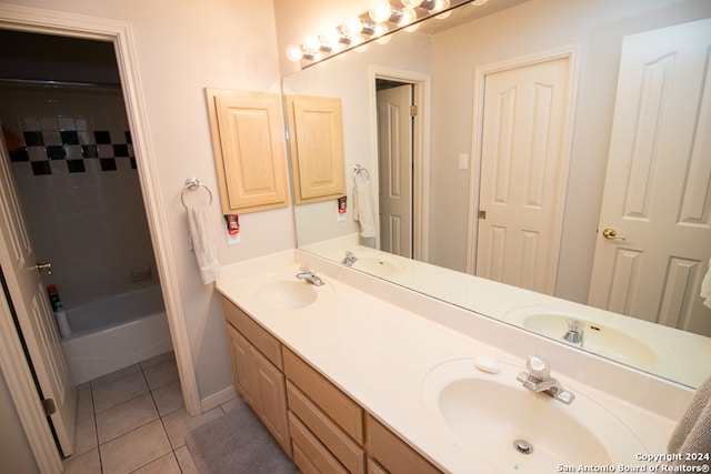 bathroom featuring tile patterned flooring and vanity