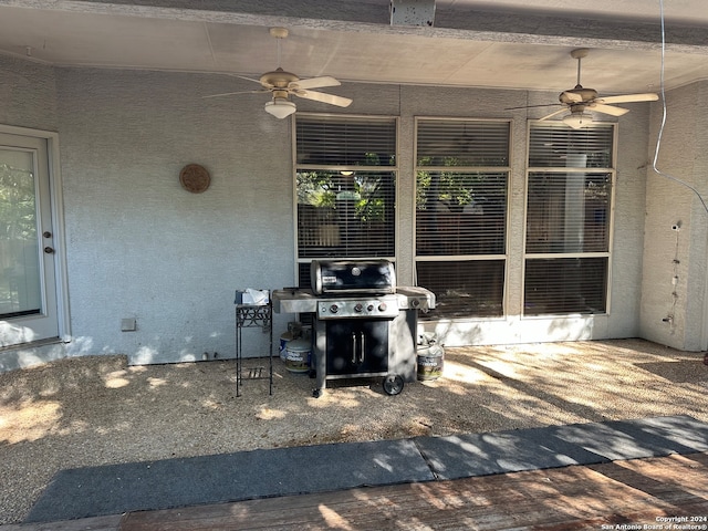 view of patio featuring a grill and ceiling fan