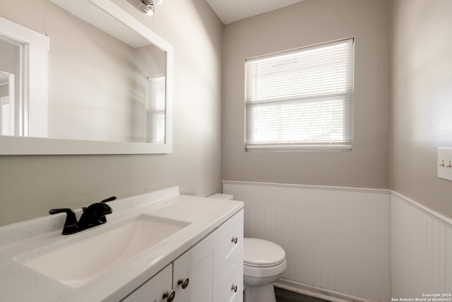 bathroom featuring vanity and toilet