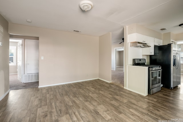 kitchen with ceiling fan, hardwood / wood-style flooring, stainless steel appliances, and white cabinets