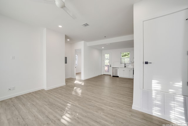 interior space with light hardwood / wood-style floors and sink