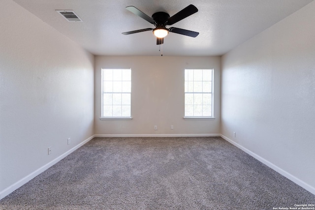 7419 Cedar Farm, San Antonio, TX 78239 - empty room featuring carpet floors, a ceiling fan, visible vents, and a wealth of natural light