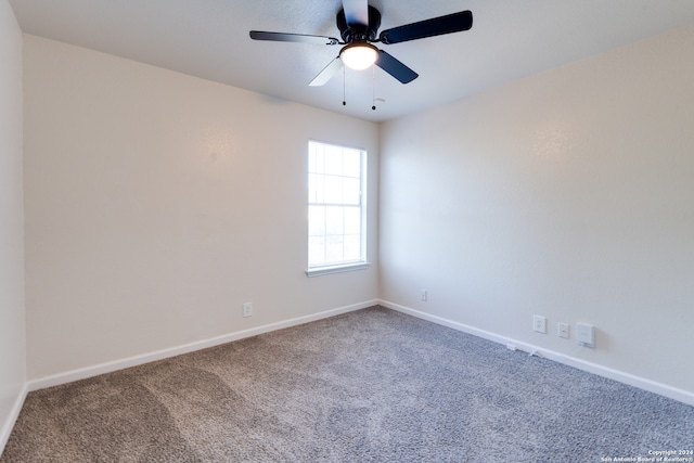 spare room featuring carpet floors and ceiling fan