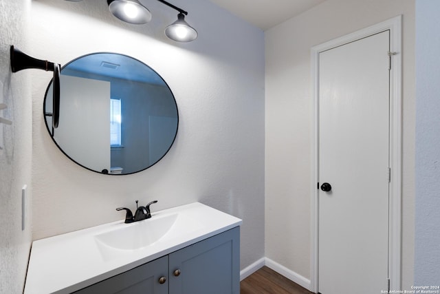 7419 Cedar Farm, San Antonio, TX 78239 - bathroom with baseboards, visible vents, wood finished floors, and vanity