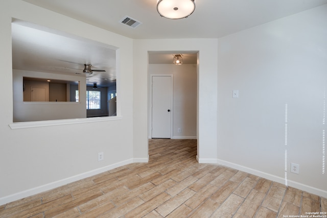 empty room featuring light hardwood / wood-style floors and ceiling fan