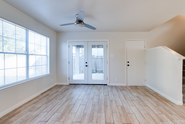 doorway to outside with light hardwood / wood-style floors, french doors, and ceiling fan