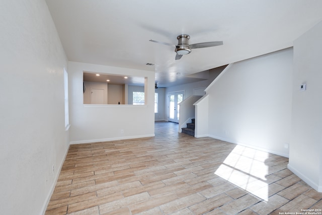 unfurnished room featuring ceiling fan and light wood-type flooring