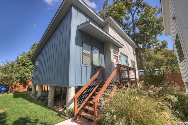 view of home's exterior with a yard