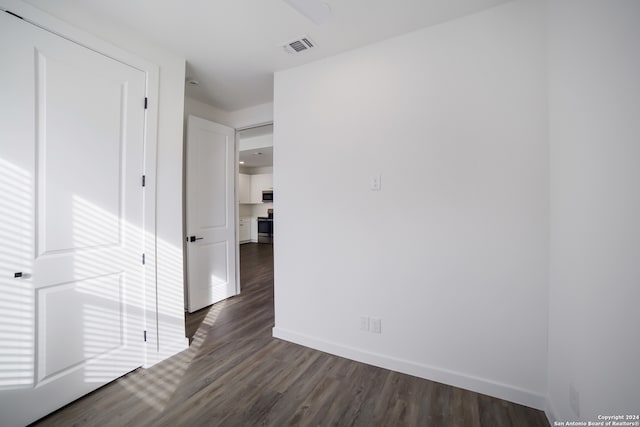 hall with dark hardwood / wood-style floors