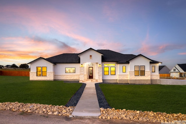 view of front of home with a lawn