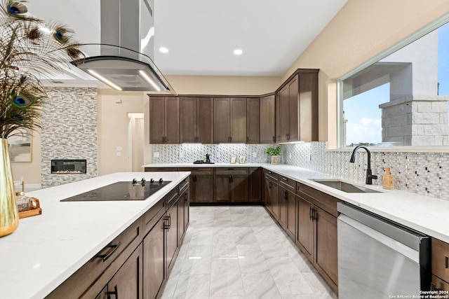 kitchen with backsplash, dishwasher, a stone fireplace, black electric stovetop, and sink