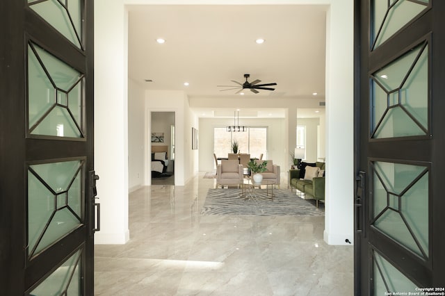 foyer featuring ceiling fan