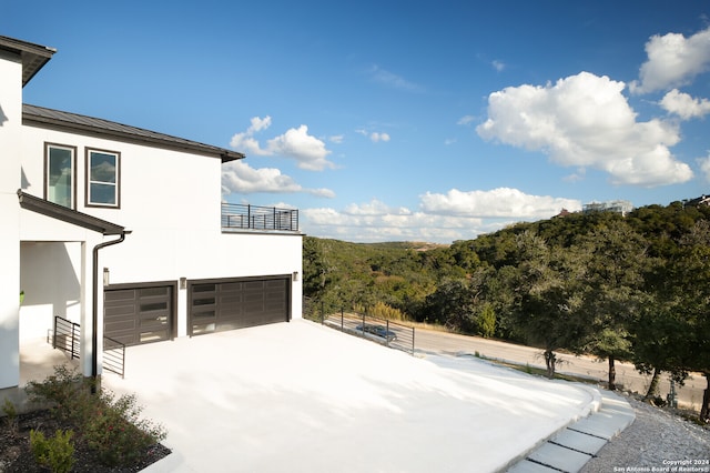 view of patio featuring a garage