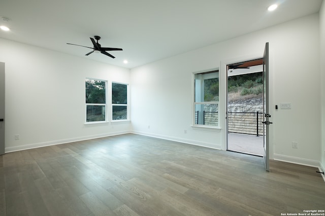 spare room with wood-type flooring and ceiling fan