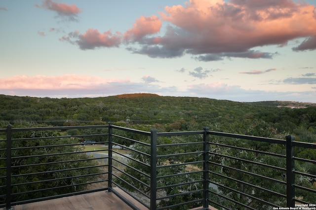 view of balcony at dusk