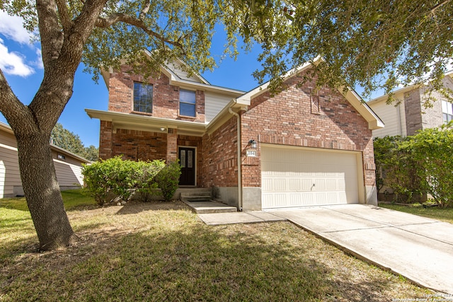 view of front of house featuring a front lawn and a garage