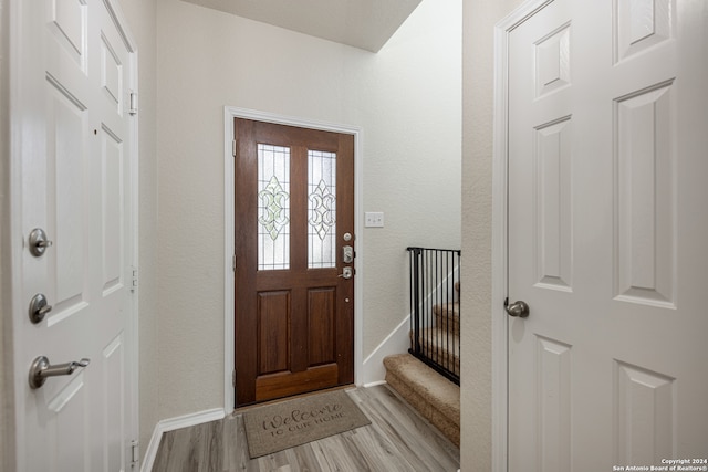 entryway with light hardwood / wood-style floors