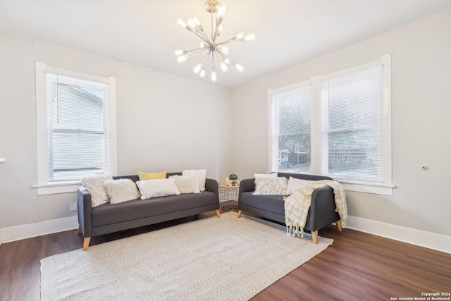 1112 W Huisache Ave, San Antonio, TX 78201 - living area featuring baseboards, a chandelier, and wood finished floors