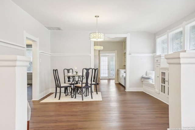 1112 W Huisache Ave, San Antonio, TX 78201 - dining space featuring baseboards, visible vents, and dark wood-type flooring