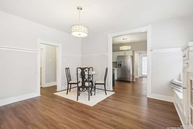 dining space featuring dark hardwood / wood-style flooring