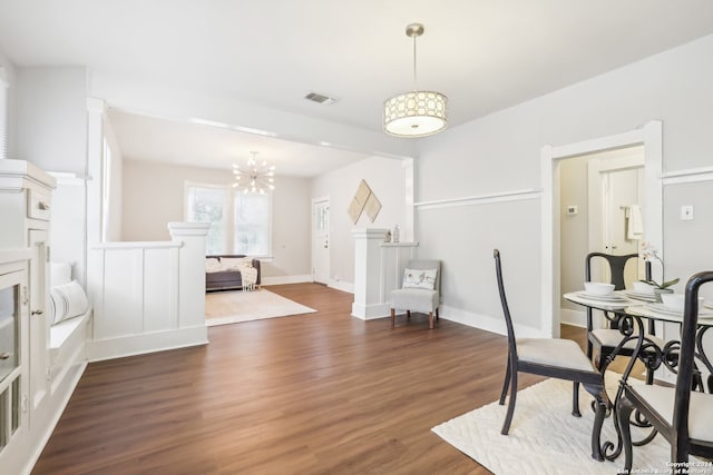 office featuring dark wood-type flooring and a notable chandelier