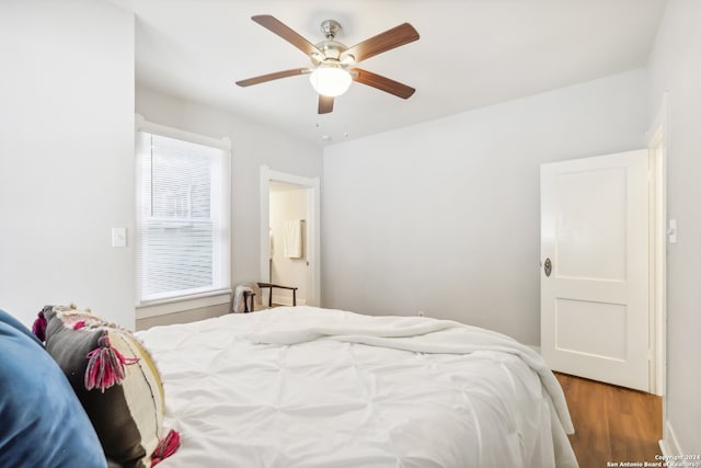 bedroom with wood-type flooring and ceiling fan