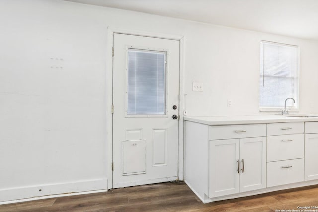 1112 W Huisache Ave, San Antonio, TX 78201 - doorway featuring dark wood finished floors and a sink