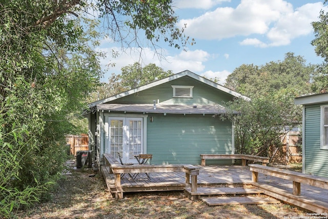 1112 W Huisache Ave, San Antonio, TX 78201 - rear view of house with french doors, fence, and a wooden deck
