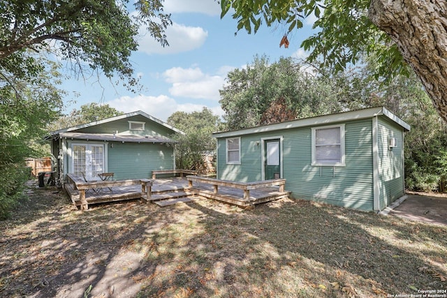 1112 W Huisache Ave, San Antonio, TX 78201 - rear view of house with a wooden deck and french doors