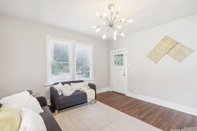 1112 W Huisache Ave, San Antonio, TX 78201 - living area with baseboards, wood finished floors, and a chandelier