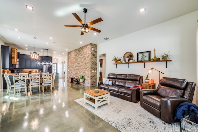 living room featuring ceiling fan and concrete flooring