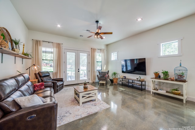 living room with french doors, ceiling fan, and a healthy amount of sunlight