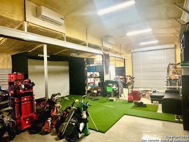 garage with an AC wall unit