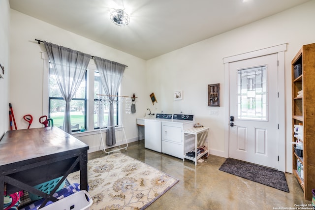 laundry area with washing machine and clothes dryer