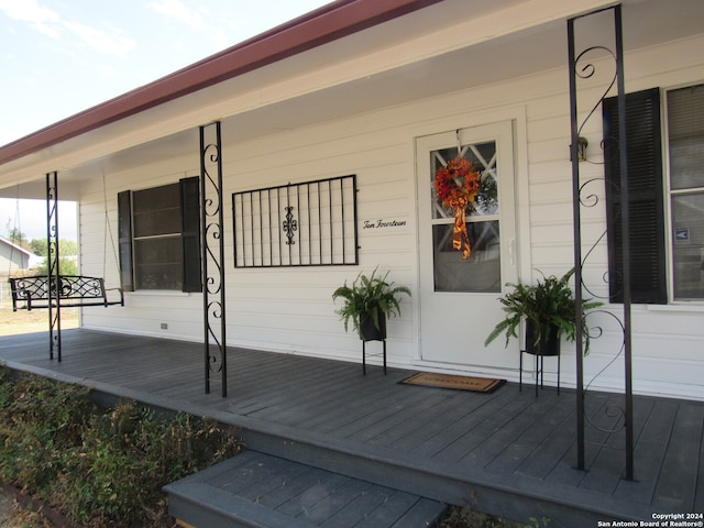 entrance to property with a porch