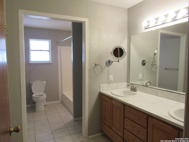 full bathroom featuring toilet, bathtub / shower combination, vanity, and tile patterned flooring