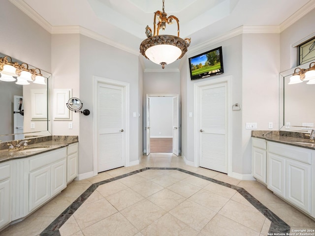 bathroom with vanity, crown molding, and tile patterned flooring