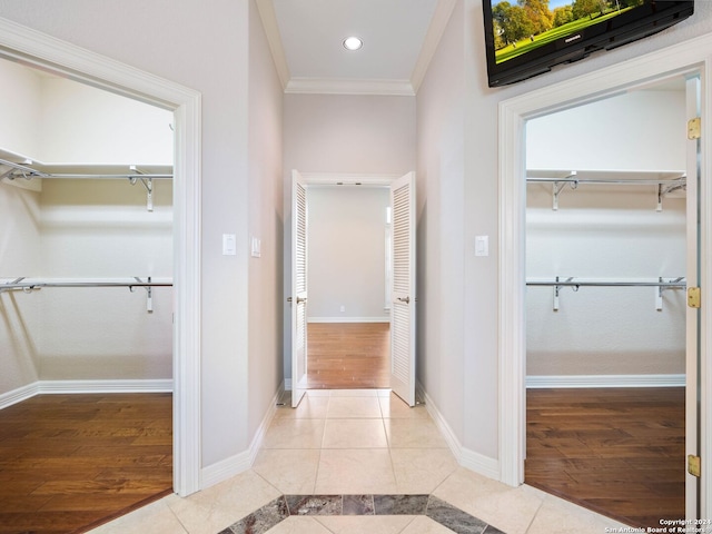 bathroom with crown molding and hardwood / wood-style flooring